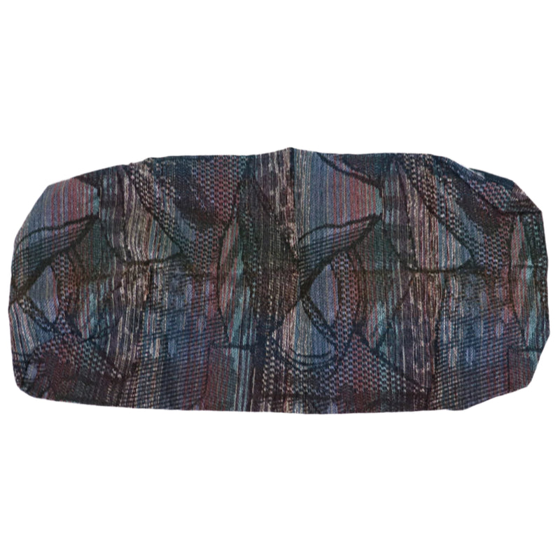 A multicolored cushion cover with a pattern that includes shades of blue, red, and beige.
