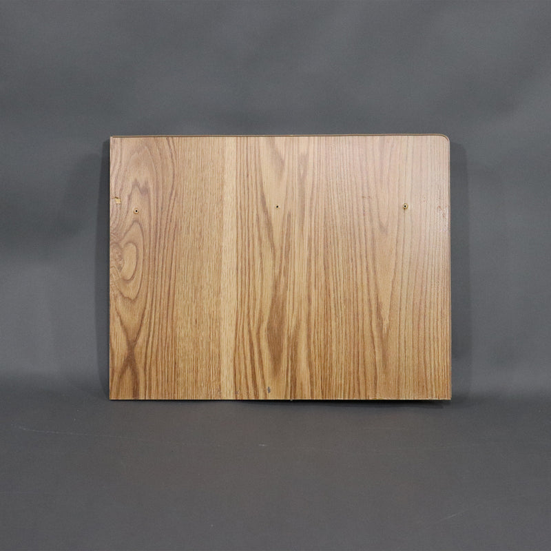 A brown wood seat end panel for a dinette, with visible grain and slight curve at the edges.