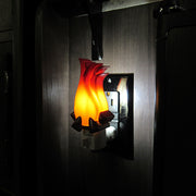 campfire nightlight shown illuminated in a camper