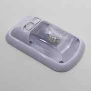 Bright white LED ceiling light with an on/off switch, showcasing a sleek, compact design with a clear, optic snap-in lens shown from the side