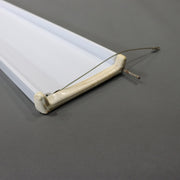 A white bed shelf as shown from the side
