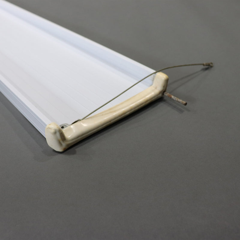 A white bed shelf as shown from the side