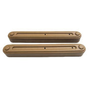 Two brown metal chain cover guards for a galley sink lift system.