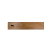 A brown metal galley filler with Velcro tabs, designed to simulate birch wood.
