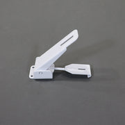 A white metal latch for securing the roof and storage boxes on pop-up campers.
