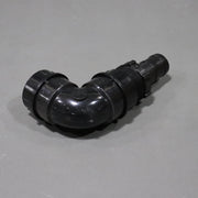 A black sink drain elbow, approximately 7 inches long by 4 inches tall shown from the back
