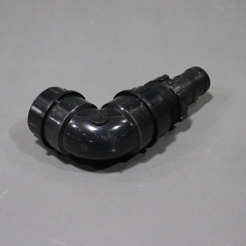 A black sink drain elbow, approximately 7 inches long by 4 inches tall shown from the back