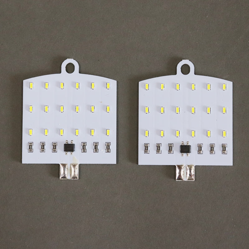 Two LED bulbs with a flat socket design, intended for vehicle interior lighting.
