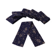 A set of six navy blue curtain ties with a dotted pattern, laid out on a white background.