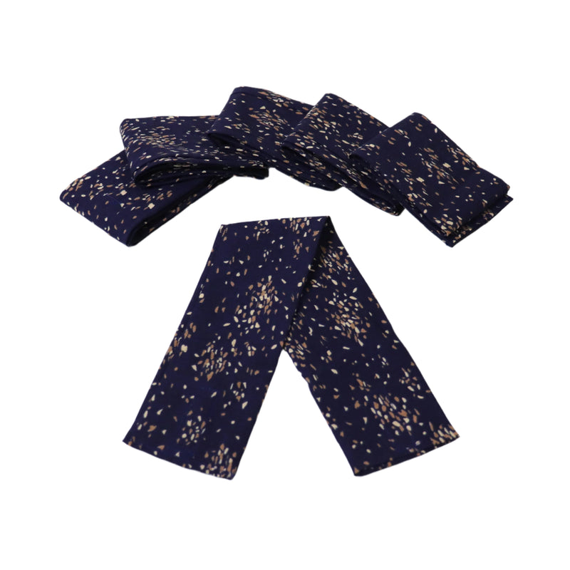 A set of six navy blue curtain ties with a dotted pattern, laid out on a white background.