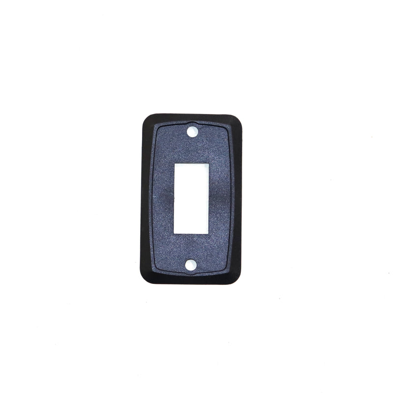 A black mounting plate for 12 volt switches, intended for use in a pop up camper.