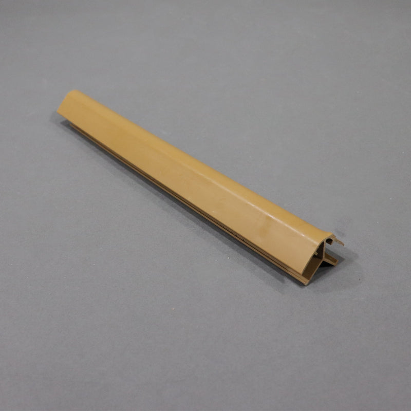 A beige-colored piece of furniture trim molding, made of plastic, displayed against a plain background.