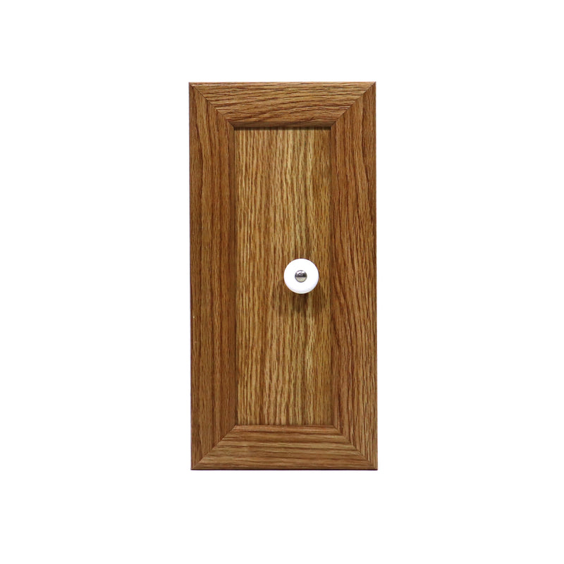 Cabinet door with a wood finish and a metal knob.