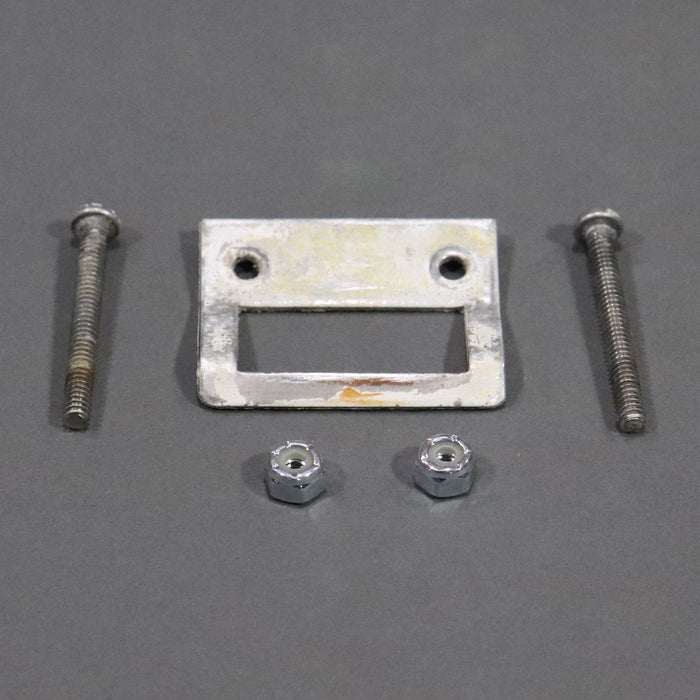 A white metal latch catch designed for securing a pop up roof on a recreational vehicle.