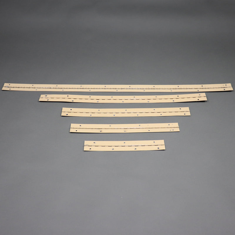 Four beige folding wall hinges laid out on a grey background.