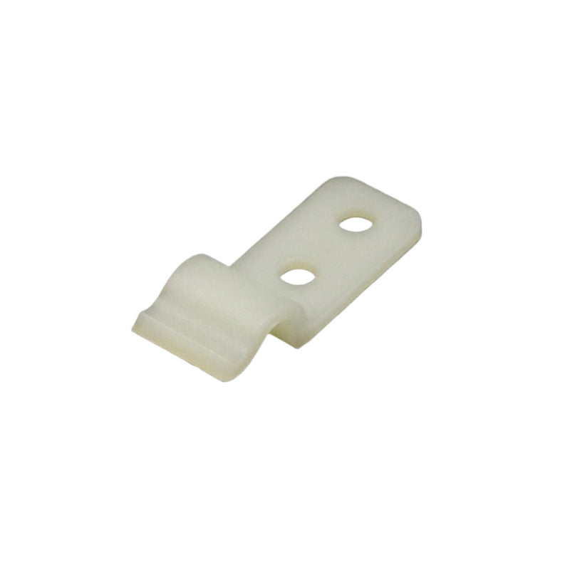 A small white plastic clip typically used to secure a stove support rod in a stored position inside an entry door.