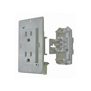 A white 15 amp power outlet with its backing and faceplate cover, isolated on a white background.