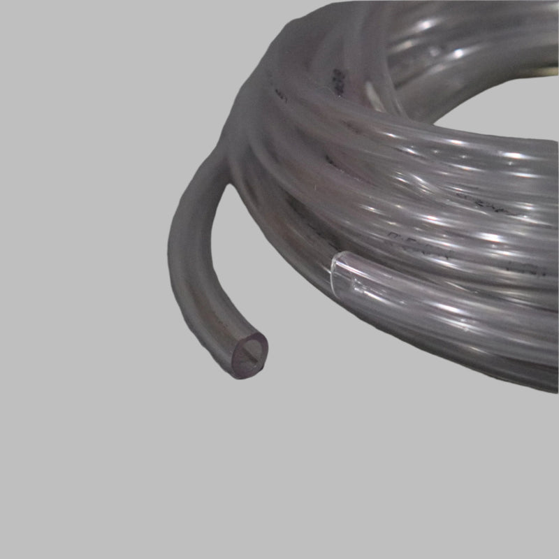 A coiled clear 1/4 inch water line on a grey surface.