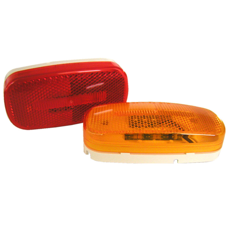 Two LED marker lamps, one with a red cover and one with a yellow cover, both with built-in reflector optics and mounting patterns for vehicles.