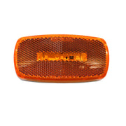 An oval-shaped LED amber marker lamp with a white base, designed for vehicle running lights.